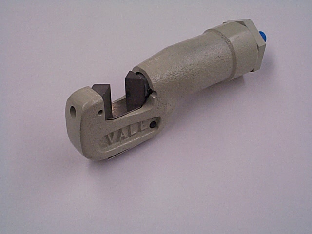 Industrial pipe cutter tool on white background.